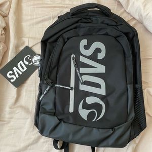DVS Backpack. 4 Compartments with Laptop Sleeve. Lots of extra pockets inside.
